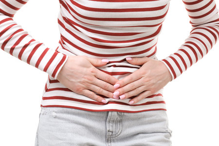 Woman suffering from cystitis symptoms on white background, closeup