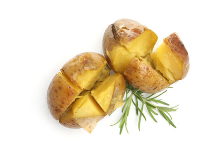 Two tasty baked potatoes with rosemary isolated on white, top viewの写真素材