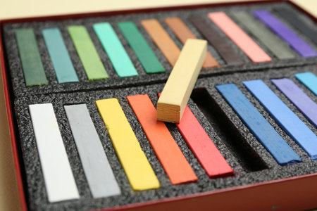 Set of colorful chalk pastels on beige background, closeupの写真素材