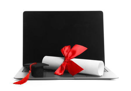 Small graduation cap, laptop and diploma isolated on whiteの写真素材