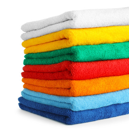 Stack of colorful terry towels isolated on whiteの写真素材