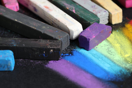 Colorful chalk pastels on black background, closeupの写真素材