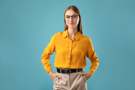 Portrait of confident woman on blue backgroundの写真素材