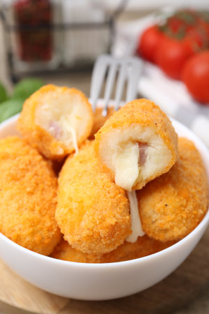 Delicious fried croquettes in bowl on table, closeupの写真素材