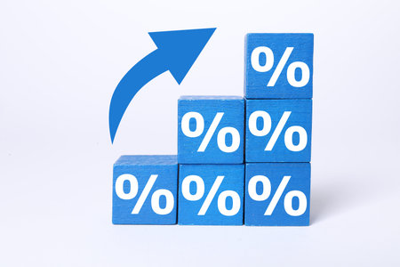 Percent signs on blue cubes and arrow against white background