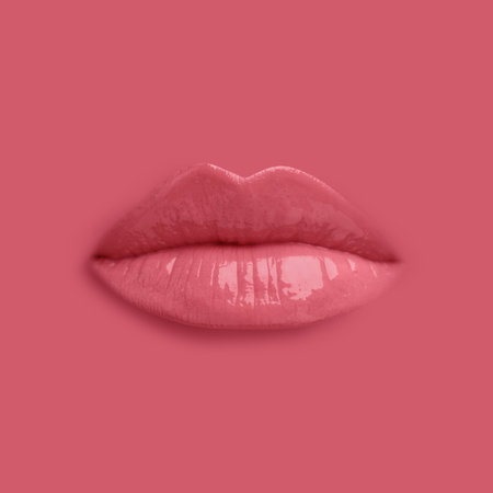 Woman's lips against background matching color of her lipstickの写真素材