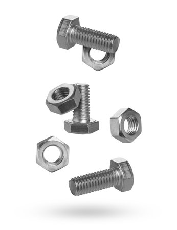 Metal nuts and bolts falling against white background