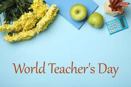 Happy Teacher's Day greeting card with flowers, stationery and text on light blue backgroundの写真素材