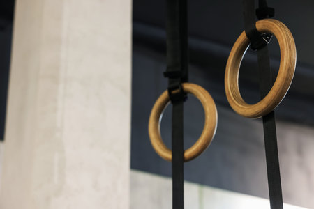 Rings hanging in gym, low angle view.の写真素材