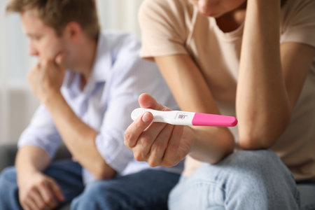 Couple with pregnancy test at home, selective focusの写真素材