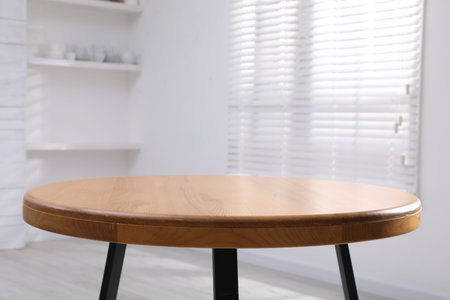 Empty wooden table indoors, closeup. Stylish furniture