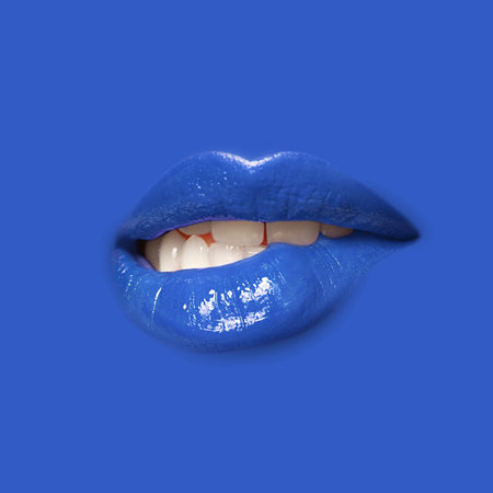 Woman's lips against background matching color of her lipstickの写真素材