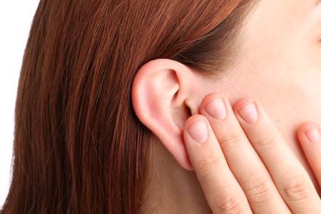 Sound. Woman touching her ear on white background, closeupのeditorial素材