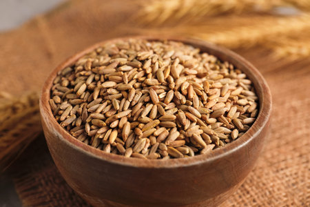 Rye grain and spikes on table, closeup