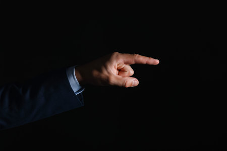Man touching something on black background, closeupの写真素材