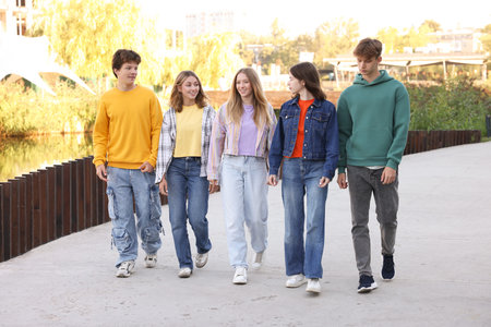 Group of teenagers walking on city street