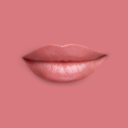 Woman's lips against background matching color of her lipstickの写真素材