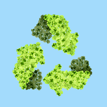 Recycle sign. Chasing arrows with pattern of green leaves on light blue backgroundの写真素材