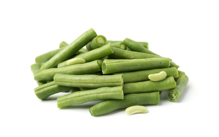 Pieces of fresh green beans isolated on white