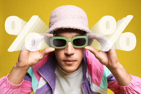 Fashionable man against yellow background