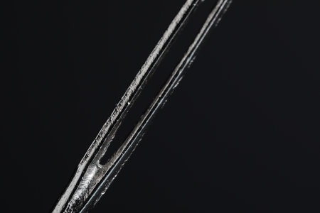 Sewing needle on black background, macro viewの写真素材
