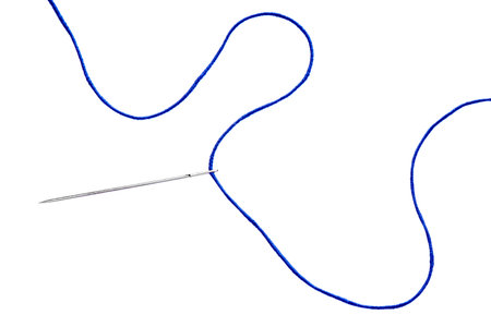 Sewing needle with blue thread isolated on white