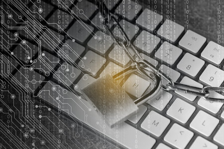 Padlock and chain on computer keyboard, closeup. Circuit board pattern and binary code. Cyber...
