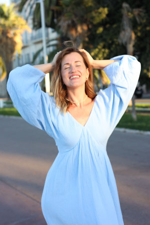 Portrait of beautiful woman on city streetの写真素材