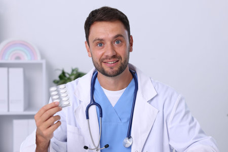 Pediatrician recommending pills during video call with patient, view from cameraの写真素材