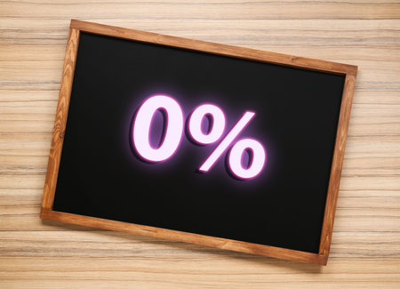 Chalkboard with 0% on wooden background, top viewの写真素材