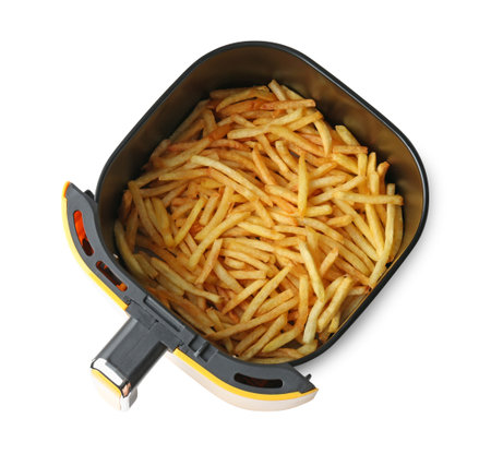 Air fryer basket with cooked fries isolated on white, top view