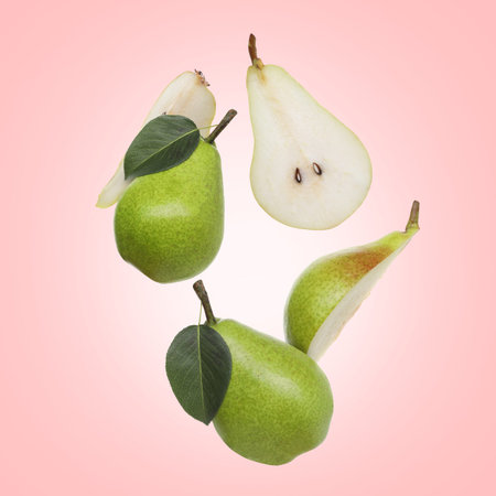 Fresh green pears on pink backgroundの写真素材