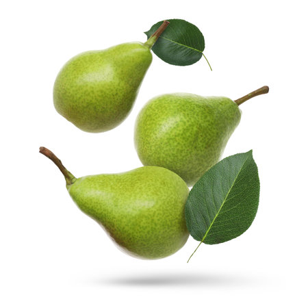 Fresh green pears flying in the air on white backgroundの写真素材