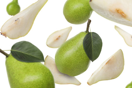 Fresh green pears flying in the air on white backgroundの写真素材