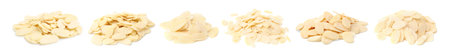 Almond slices in heaps isolated on white, set