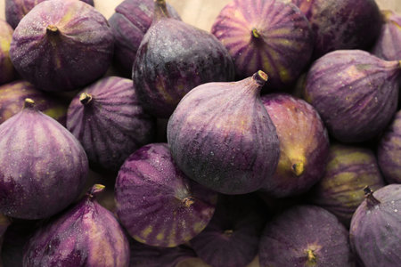 Fresh ripe figs as background, top view