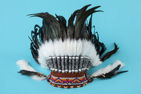Traditional warbonnet (Native American chief headdress) on light blue backgroundの写真素材