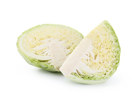 Pieces of fresh Savoy cabbage isolated on whiteの写真素材