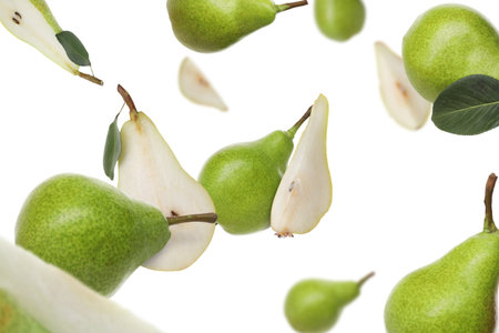 Fresh green pears flying in the air on white backgroundの写真素材