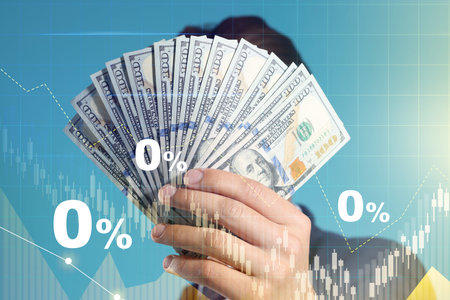 Zero percent commission. Man holding dollars against blue background, closeup