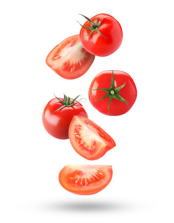 Fresh ripe tomatoes falling against white backgroundの写真素材