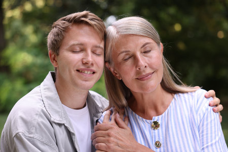 Mother and her happy sons outdoors. Family bondingの写真素材