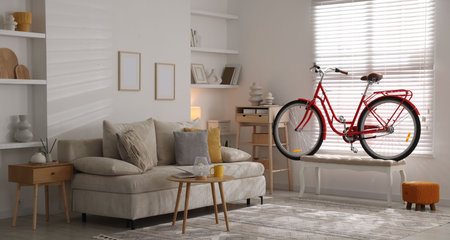Red bicycle, sofa and decor in roomの写真素材