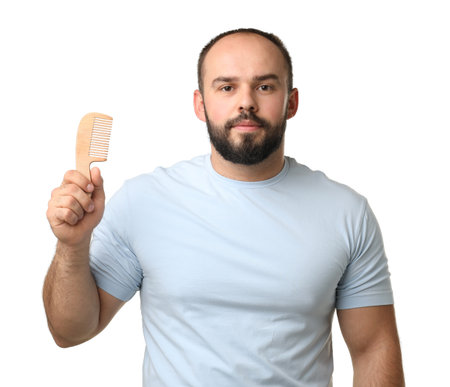 Man with comb on white backgroundの写真素材