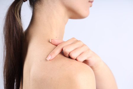 Woman with normal skin on light background, closeupの写真素材