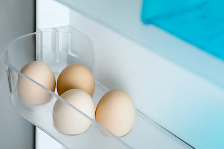 Eggs on shelf in refrigerator, closeupの写真素材
