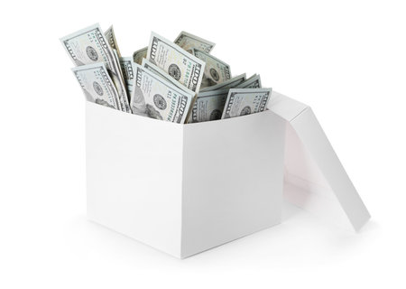 Box full of dollars isolated on whiteの写真素材