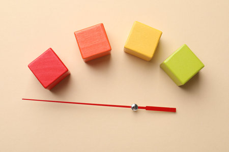 Risk. Red arrow and colorful cubes on beige background, flat layの写真素材