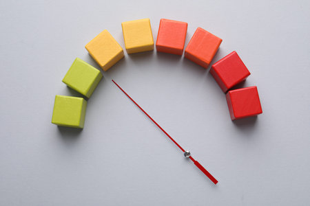 Risk. Red arrow and colorful cubes on light gray background, flat layの写真素材