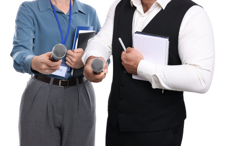 Journalists with microphones, notebooks and pen on white background, closeup